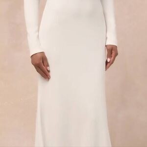 Midweight crepe knit dress with mermaid style skirt that falls to  floor-length